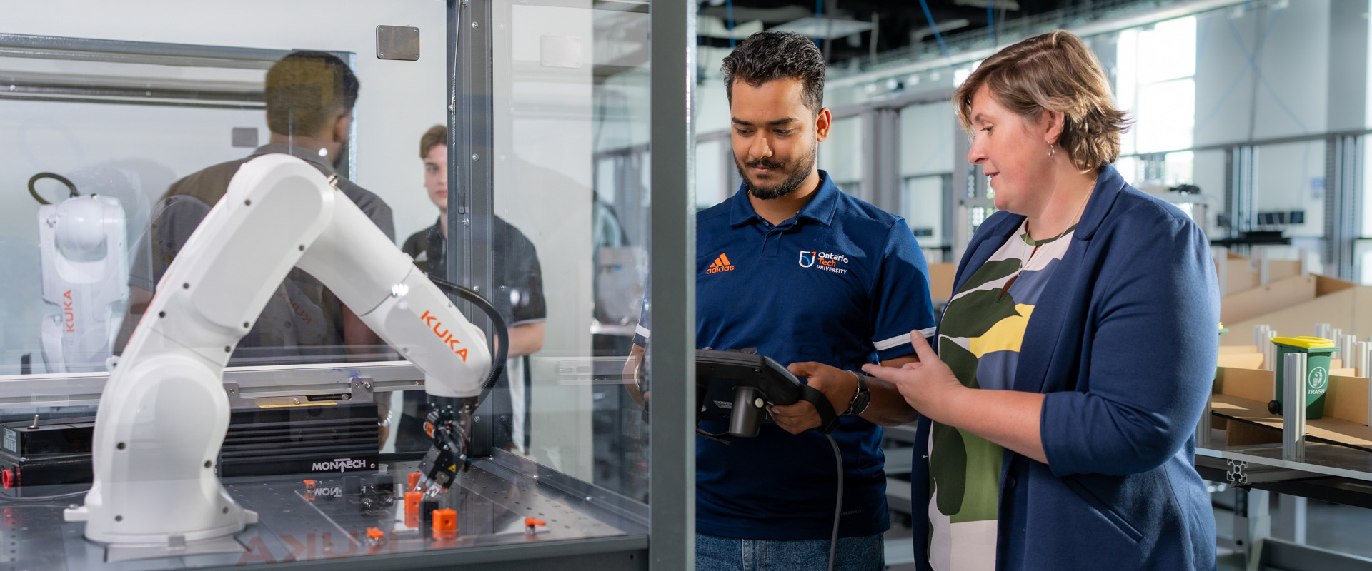 Student and professor in robotics lab