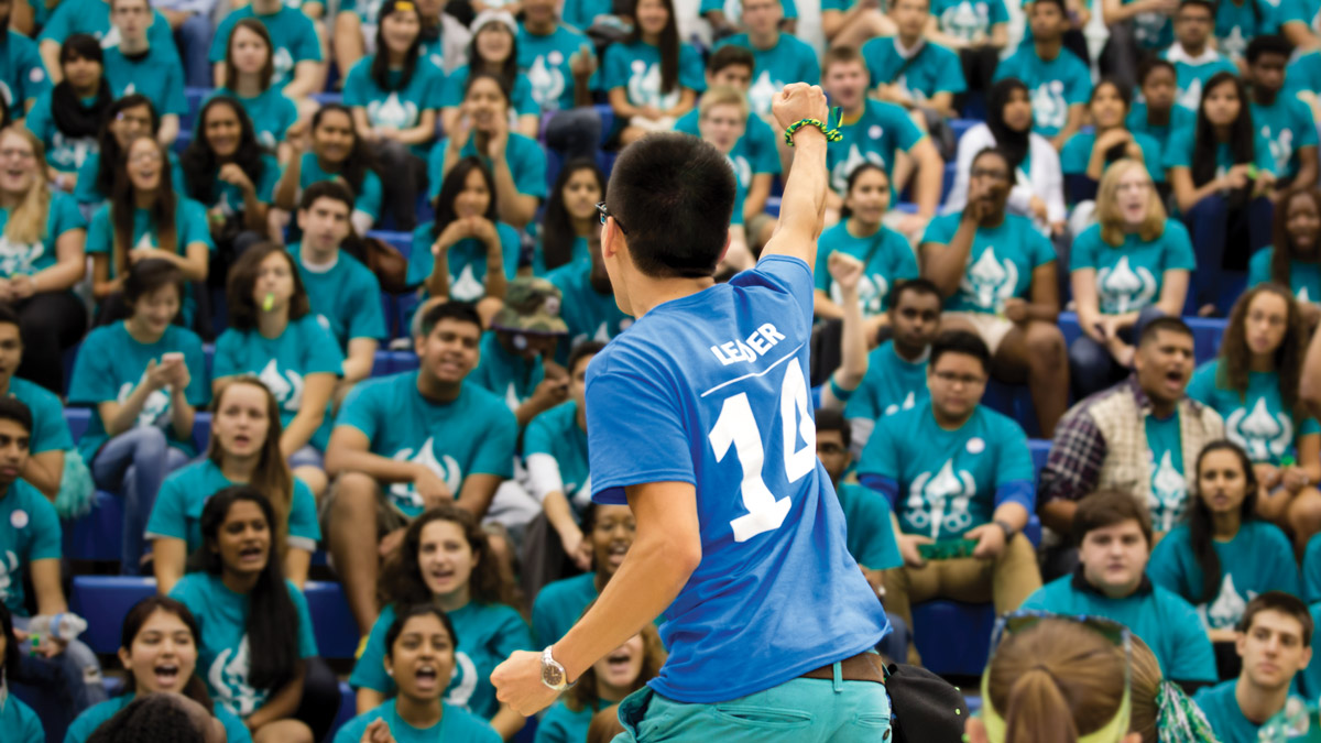 Student leader cheering at orientation event
